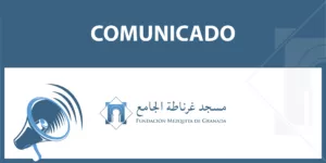 Cartel azul con la palabra Comunicado, un megáfono y el logotipo de la Fundación Mezquita de Granada